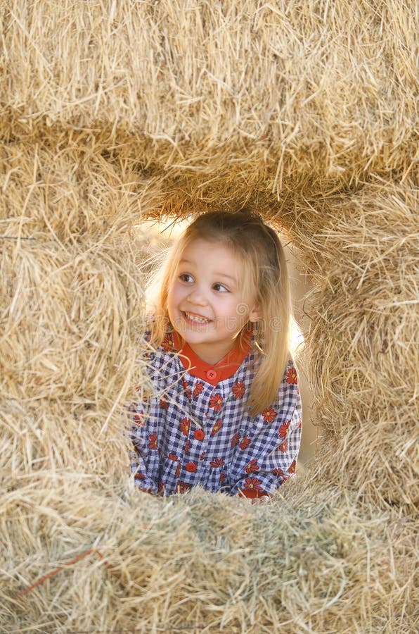 Blonde Little Girl In Haystack