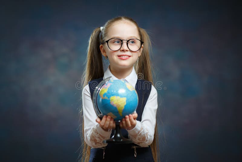 Blonde Little Schoolgirl Hold World Globe in Hand stock images Blonde Little Schoolgirl Hold World Globe in Hand stock images