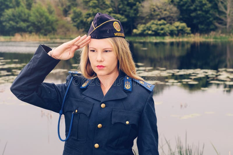 Blonde policewoman saluting