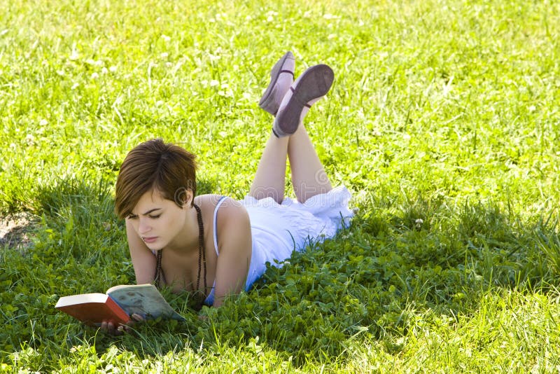 Blonde reading at park