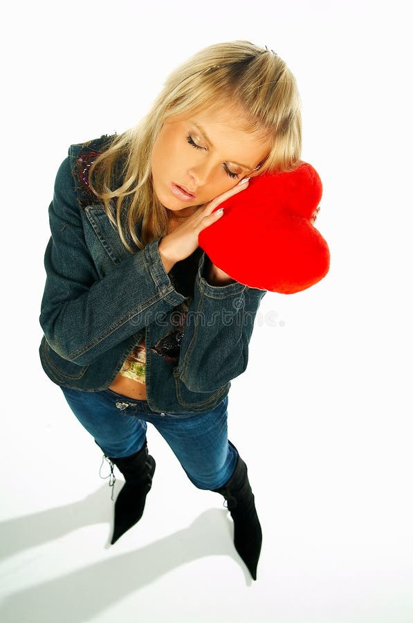 Blonde girl holding a red velvet heart 1