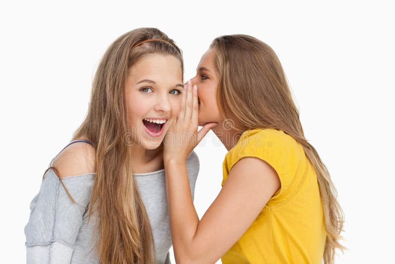 Blonde Student Whispering To Her Friend Stock Photography Image 25335392