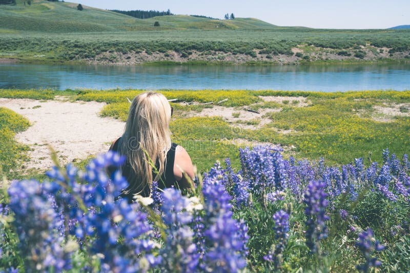 Woman with blonde hair facing away from camera - wide 7