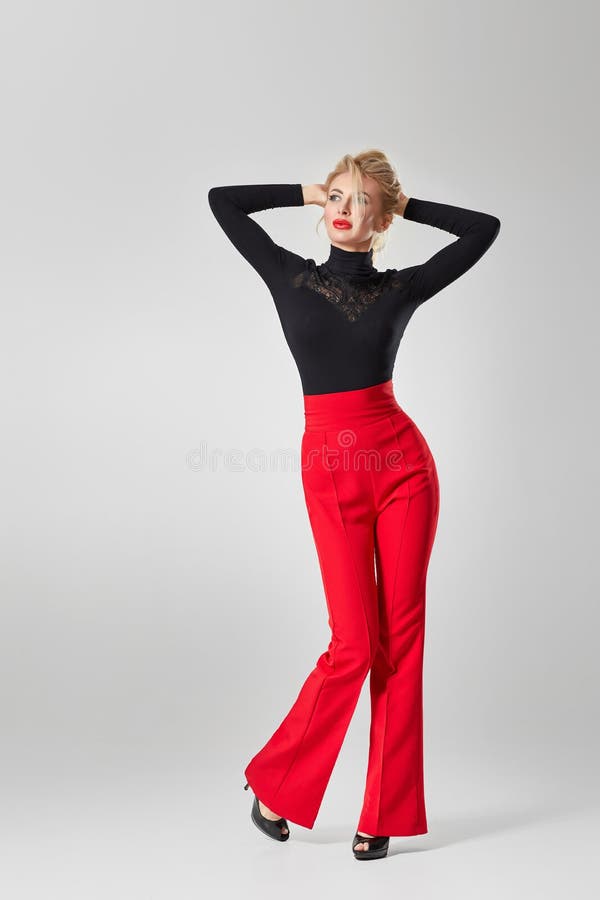 Portrait Relaxed Fashion Man Wearing Black Suit Red Pants Holding Stock  Photo by ©feedough 238868920