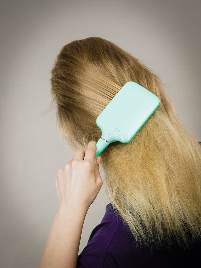 Blonde Woman Brushing Hair B