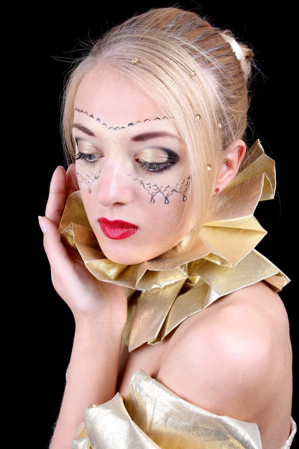 Blonde woman with golden venetian mask