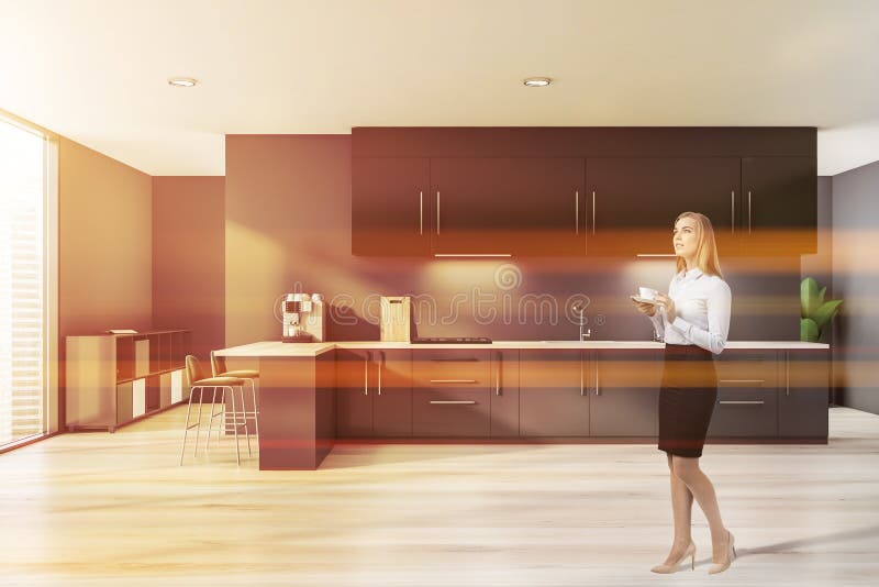 Blonde woman in luxury gray kitchen royalty free stock photo Blonde woman in luxury gray kitchen royalty free stock photo