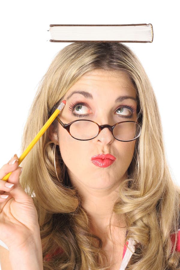 Blonde woman thinking with book on head mouth