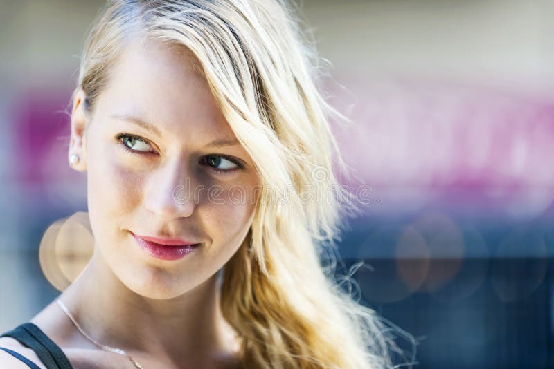 Portrait of young blonde woman looking to side with copy space. Portrait of young blonde woman looking to side with copy space