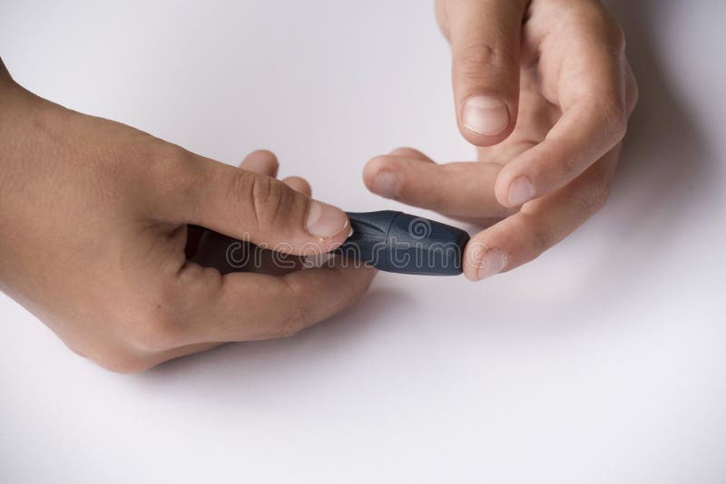 Blood Sugar Level Measurement with a Blood Glucose Meter Stock Photo