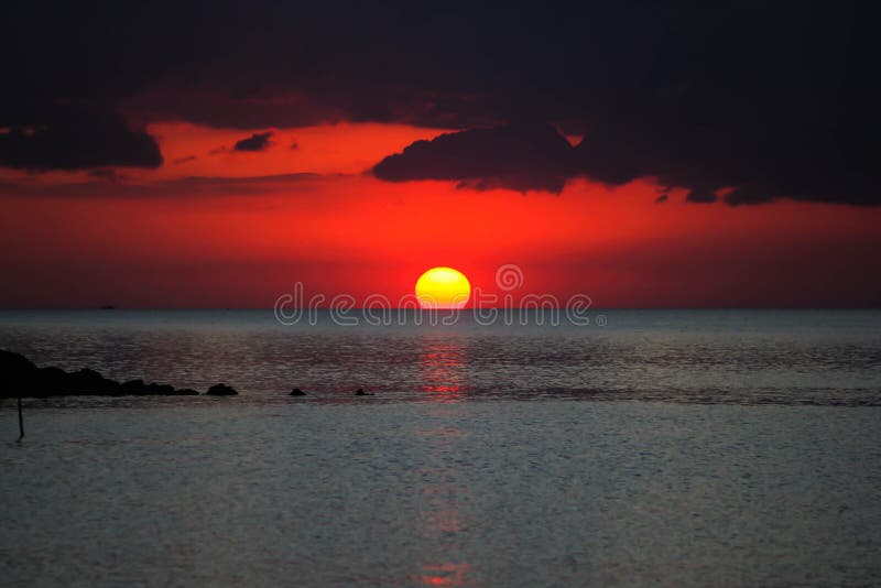 Blood sun and sky stock photo. Image of water, blue, surface - 83303966