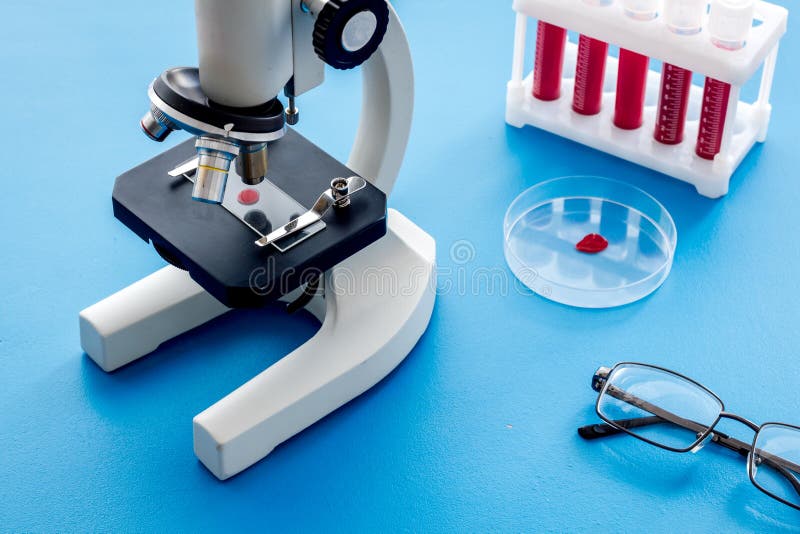 Blood Testing Laboratory. Samples Viewing Under Microscope Near Tubes