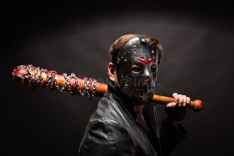 Bloody maniac in mask and black leather coat stock photography Bloody maniac in mask and black leather coat stock photography
