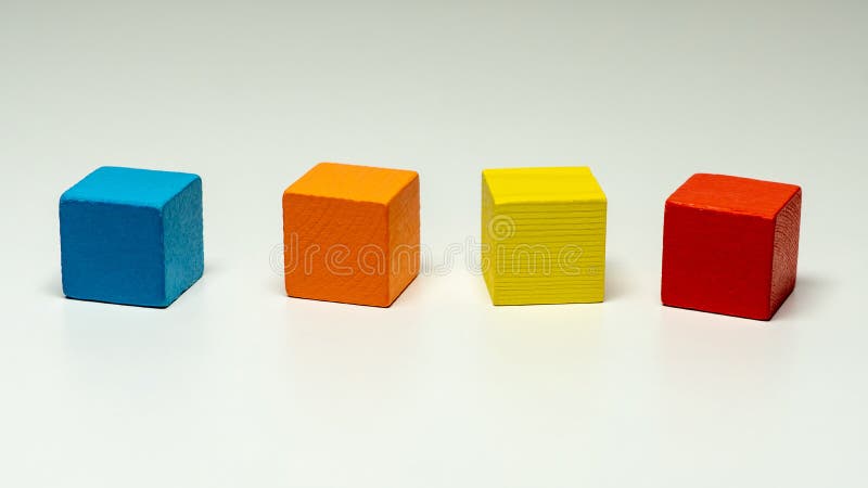 Toy blocks, multicolor wooden game cube, blank boxes isolated light background. Toy blocks, multicolor wooden game cube, blank boxes isolated light background