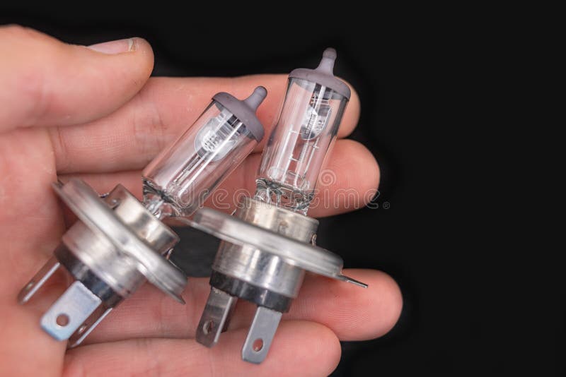 Car Headlights in the Dark at Night, only the Headlights and Grille of