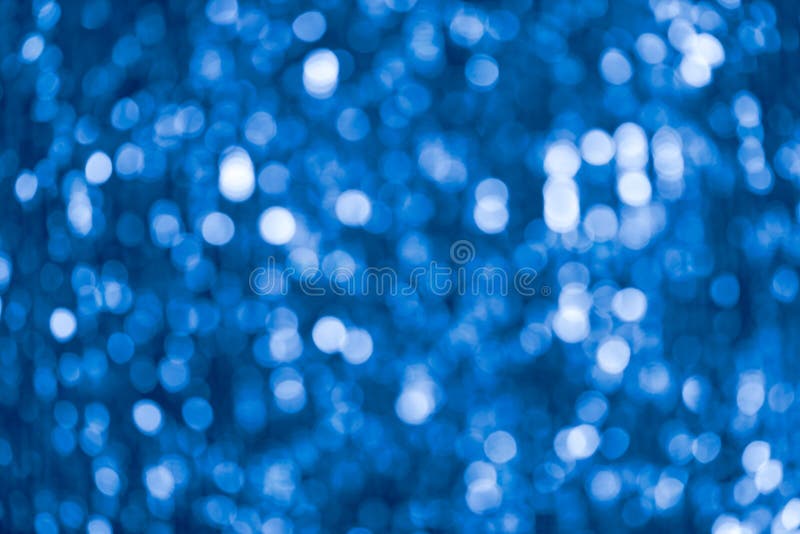 Blue Abstract Shimmering Bokeh Background with Shining Lights Stock