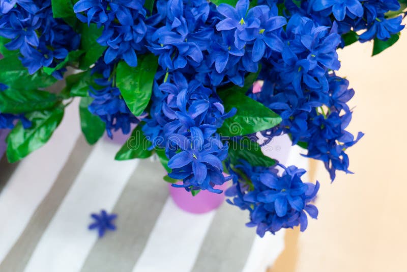 Blue Artificial Flowers in a Vase. Room Decoration with Inanimate
