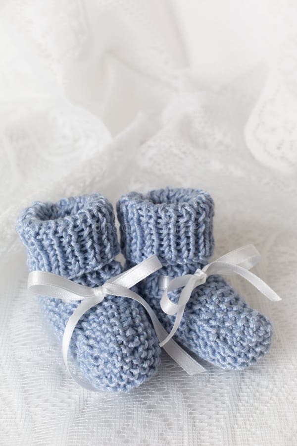 Blue Baby Booties stock photo. Image of baby, hand, blue 25319740