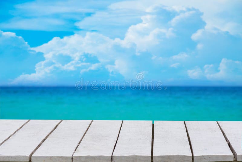 Blue background with selective focus. has a bokeh on a white wooden floor. Empty table empty space wooden table empty Wooden floor royalty free stock photo Blue background with selective focus. has a bokeh on a white wooden floor. Empty table empty space wooden table empty Wooden floor royalty free stock photo