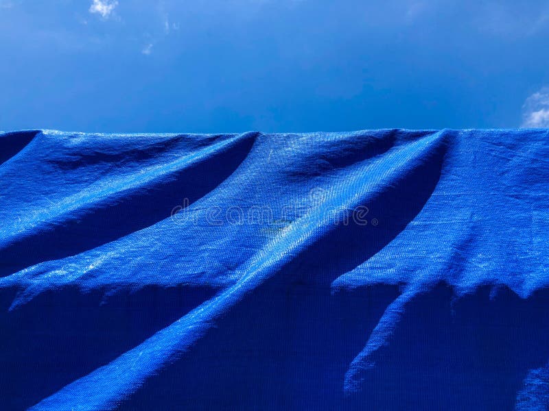 Blue Background Texture. Background of Blue Fabric and Sky Stock Photo