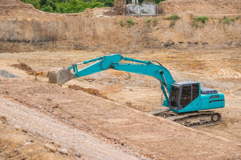 Blue Backhoe Excavating Soil and Sand Stock Image Image of bucket