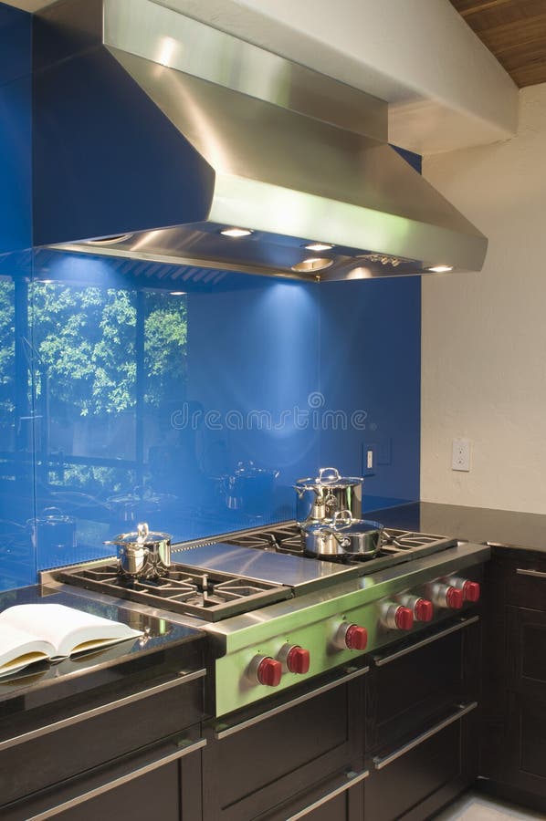 Blue Backsplash And Stainless Steel Vent Hood royalty free stock image