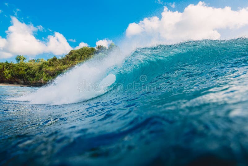 Blue barrel wave in ocean. Wave and sky in Bali