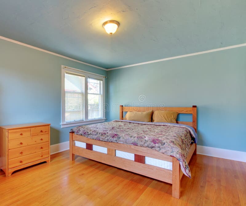 Blue Bedroom with Oak Floor and Large Bed. Stock Image Image of