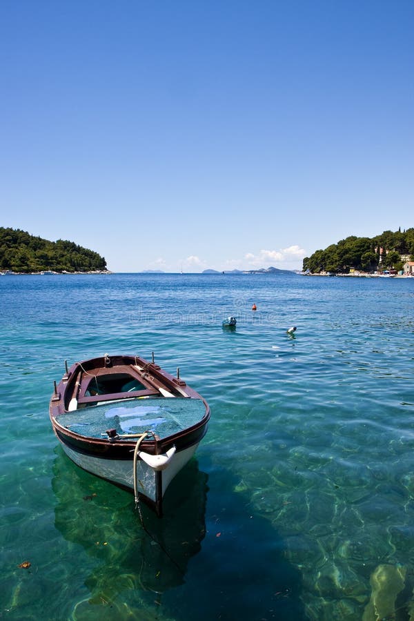 Blue Boat on Blue Water