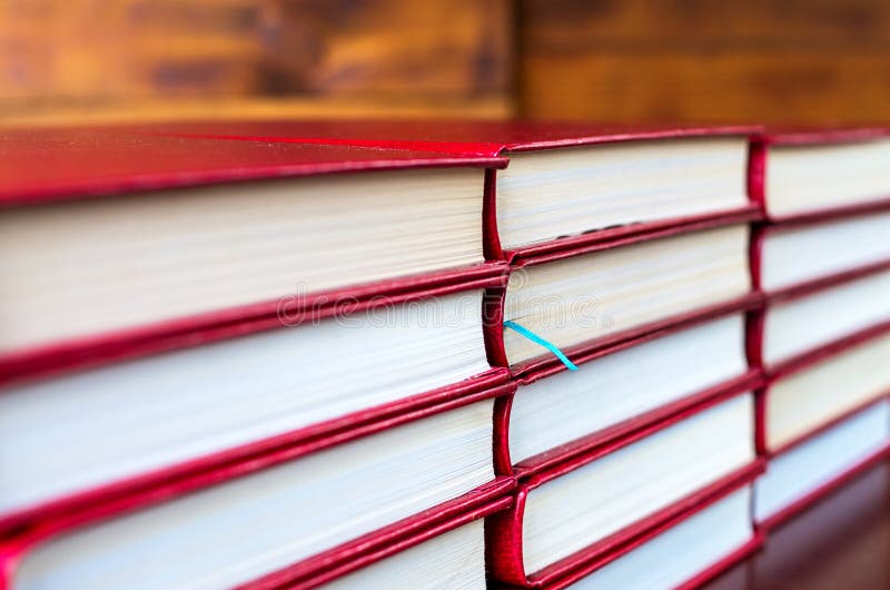Blue bookmark in one of the books stock photos