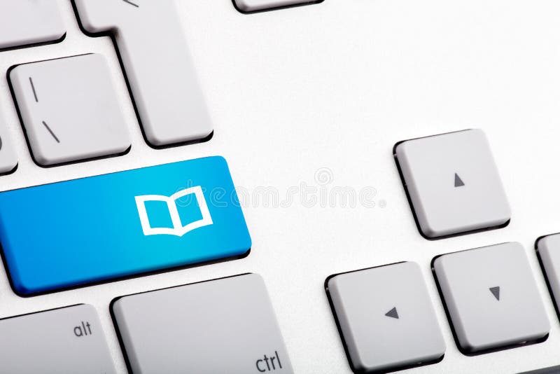 Blue Bottom on a Laptop with Open Book - Close Up royalty free stock image Blue Bottom on a Laptop with Open Book - Close Up royalty free stock image