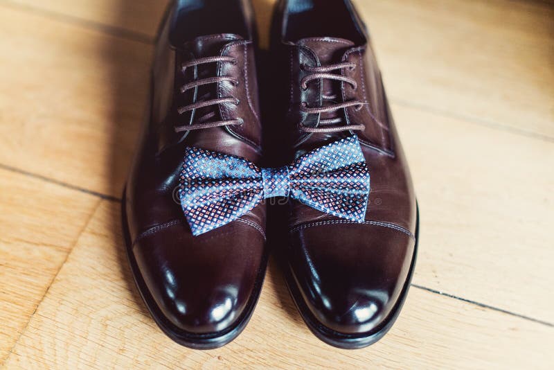 Blue Bow Tie on a Leather Brown Shoes. Grooms Wedding Morning Stock Photo - Image of brown