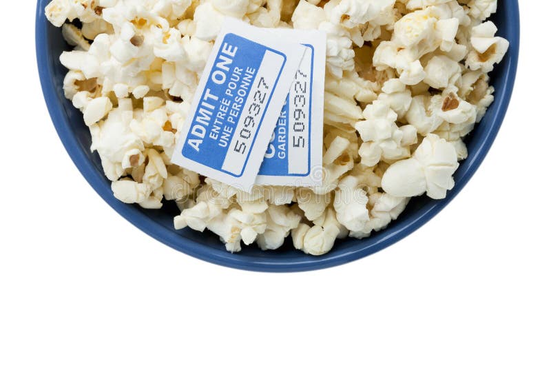 Blue bowl with popcorn and cinema tickets royalty free stock photos