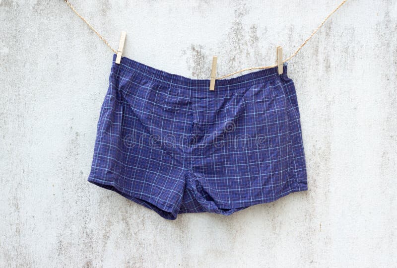 Blue boxer underwear on grunge wall stock photography Blue boxer underwear on grunge wall stock photography