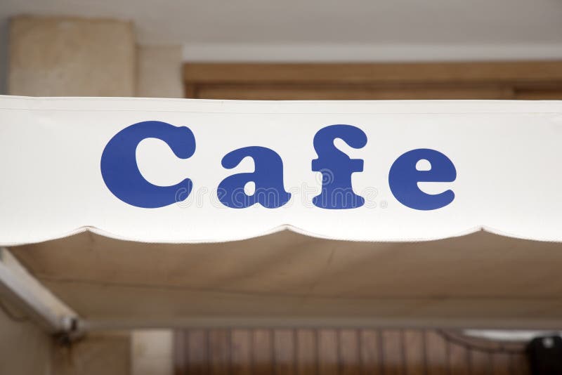 Blue Cafe Sign. In Urban Setting stock images