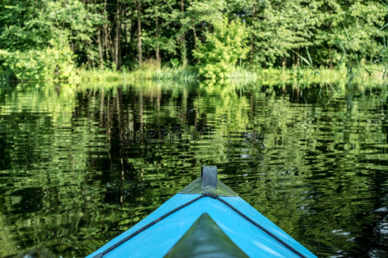 Blue canoe on the river