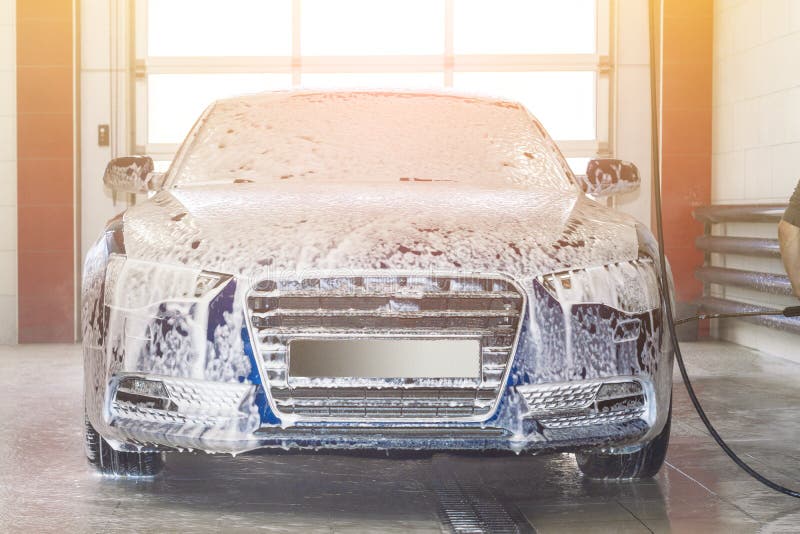 Blue Car in Foam at Car Wash. Stock Photo Image of shiny, soap 162947064