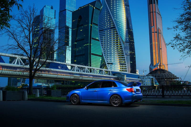 Blue car stay on road near Moscow-City at twilight royalty free stock photography Blue car stay on road near Moscow-City at twilight royalty free stock photography