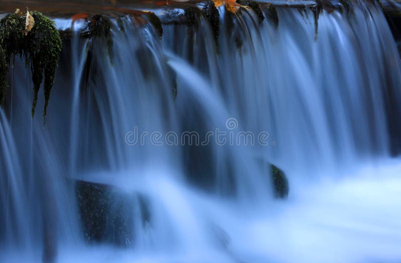 Blue cascade waterfall stock images