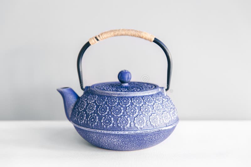 Blue Cast Iron Teapot on a White Background. Stock Photo Image of