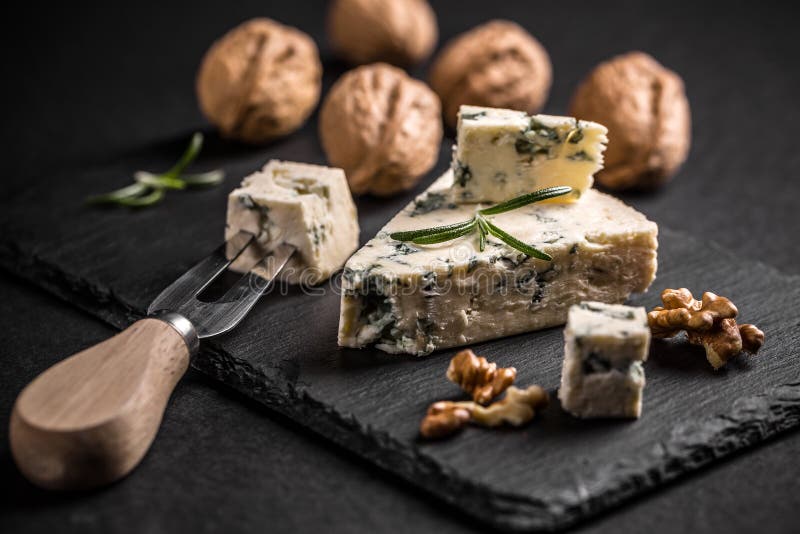 Blue cheese with nuts stock photo. Image of roquefort 62857614