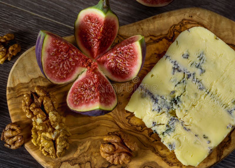 Blue Cheese and Sweet Fruit Figs, Walnut on a Wooden Board Stock Photo