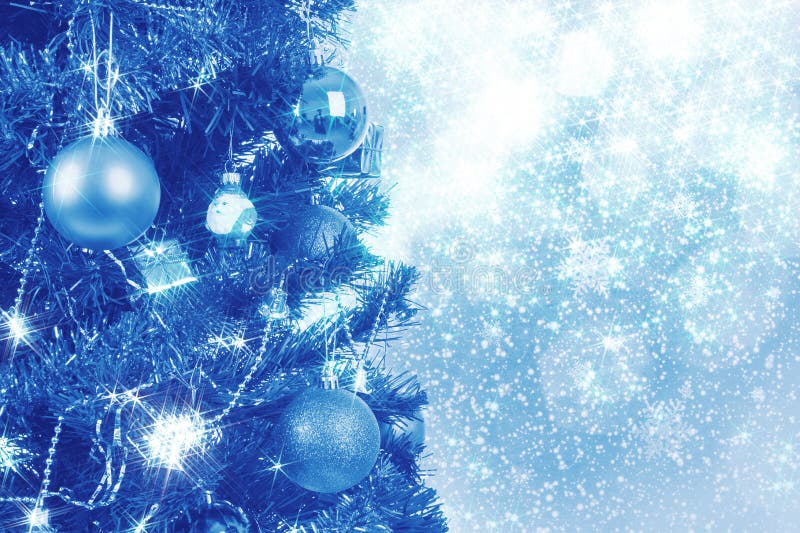 Blue christmas background with balls on tree