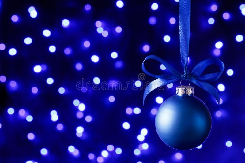 Blue Christmas Ball and Blured Purple Lights at the Background Stock