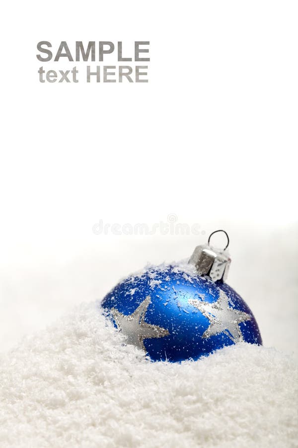 Blue christmas decoration in snow with copy space