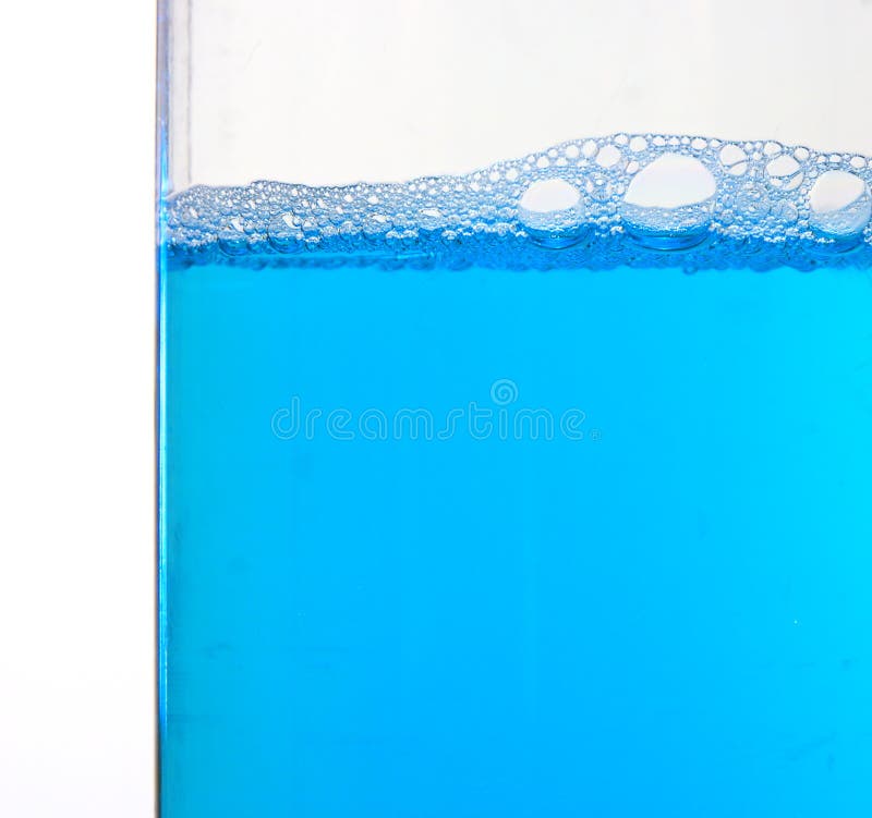 Made a foam blue cleaning liquid in a plastic vessel on a white background