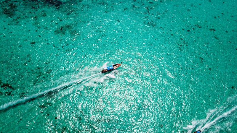 Blue Clear Water with a Fishing Boat. Aerial View from the Drone Stock ...