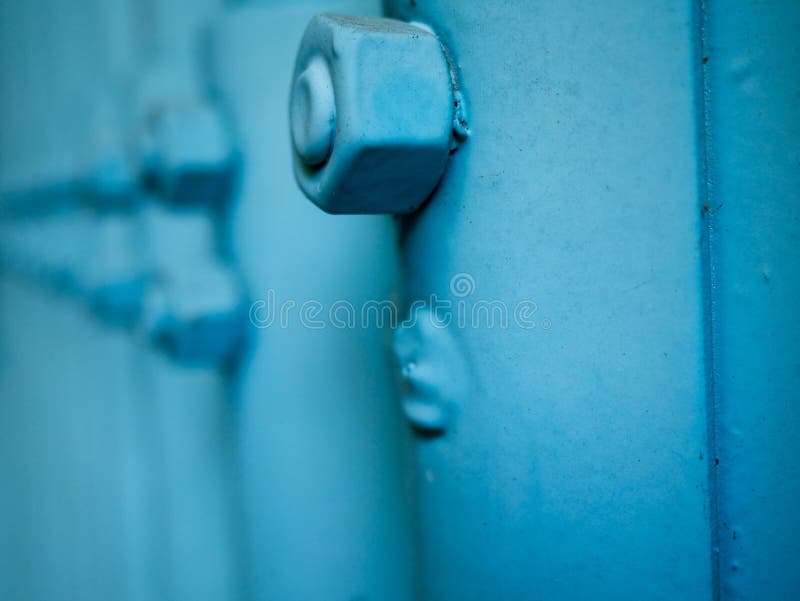 Blue coated nut dirty side view stock photos