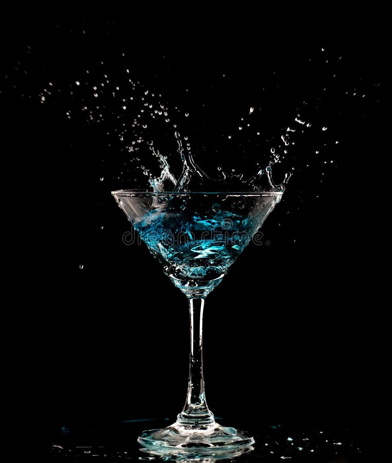 Blue Cocktail Glass with splashing water alcohol, Crystal Cocktail drink splatter splash in air and bubble from glass. Liquor Part