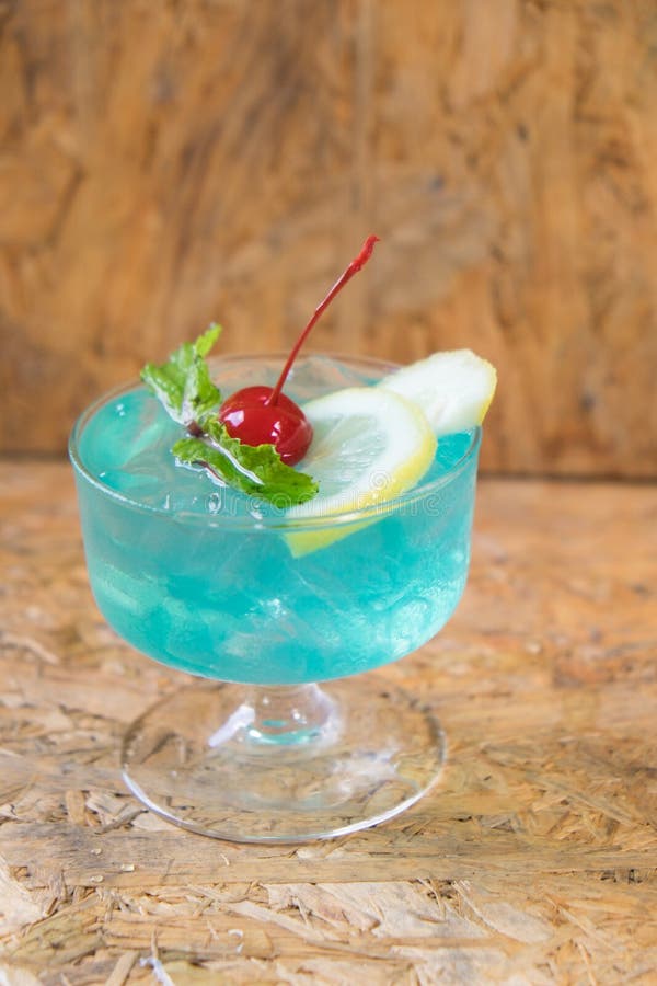 Blue Cocktail with a Slice of Lemon, Mint and Cherry Stock Image